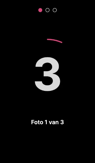Het scherm van de photobooth tijdens het aftellen, met een grote 3 en Foto 1 van 3.